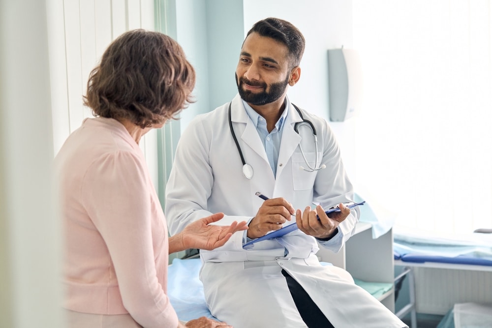 Doctor meeting with female patient to discuss hormone therapy options