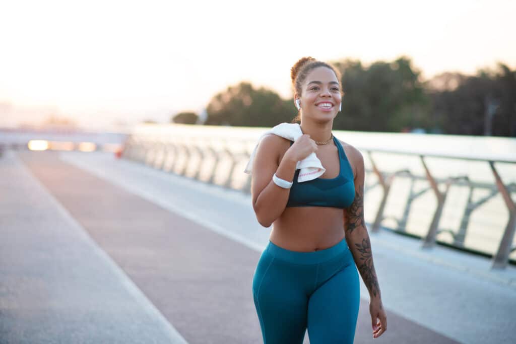 Woman walking after a workout as part of long-term weight maintenance